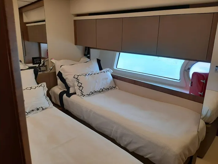  Yacht Photos Pics Luxurious twin cabin interior on a 2020 Intermarine 80 yacht, featuring elegant bedding and modern design.