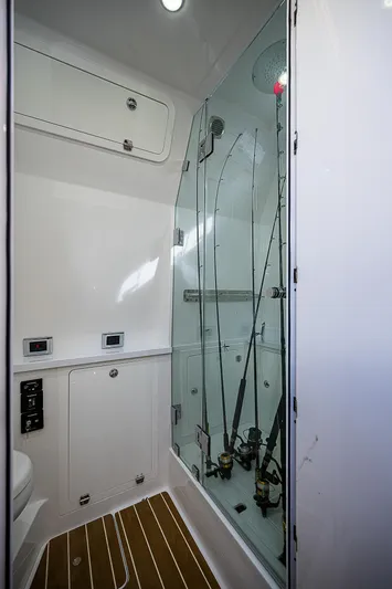  Yacht Photos Pics 2022 HCB 53 interior with fishing rod storage and sleek design.