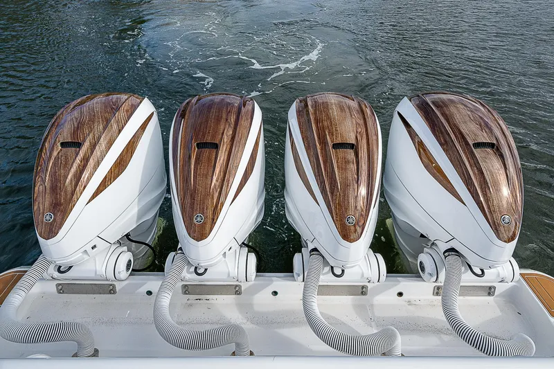  Yacht Photos Pics Four Yamaha outboard engines on a 2022 HCB 53 boat, featuring wood accents.