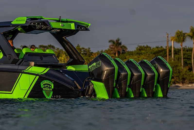  Yacht Photos Pics 2024 Adrenaline Reaper boat with multiple engines, vibrant green and black design, on water.