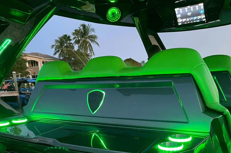  Yacht Photos Pics 2024 Adrenaline Reaper interior with green LED lighting and modern dashboard.