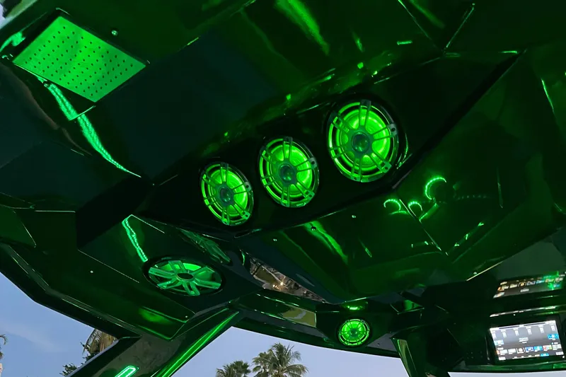  Yacht Photos Pics 2024 Adrenaline Reaper interior with vibrant green LED lighting and advanced audio system.