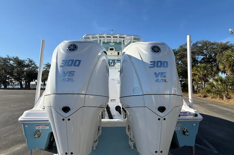  Yacht Photos Pics 2024 Sea Fox 288 Commander with twin 300 V6 engines, parked outdoors.