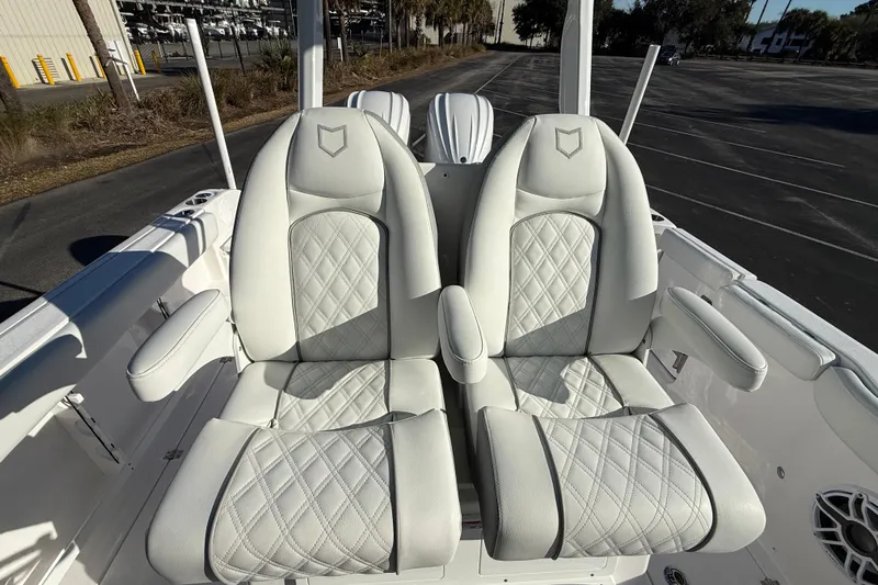  Yacht Photos Pics 2024 Sea Fox 288 Commander boat seats with white quilted upholstery.