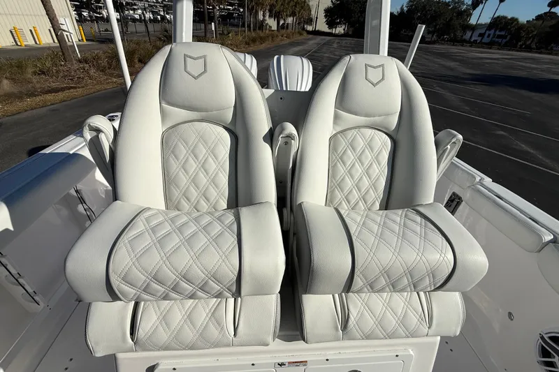  Yacht Photos Pics 2024 Sea Fox 288 Commander boat seats with diamond-pattern upholstery.