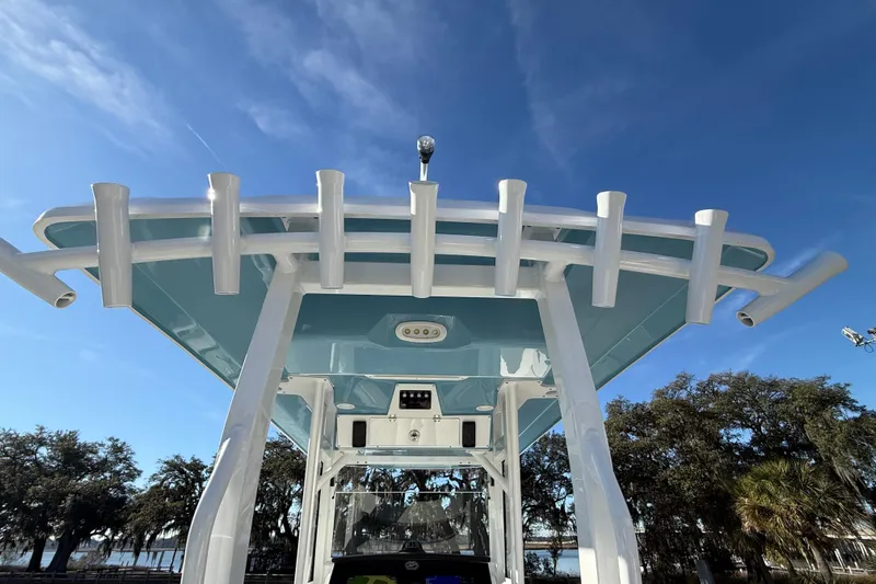  Yacht Photos Pics 2024 Sea Fox 288 Commander boat with rod holders and blue sky background.