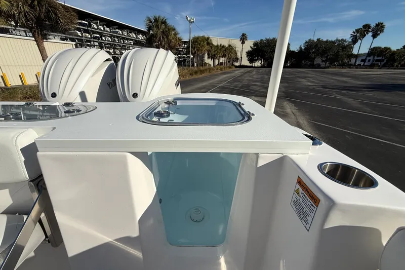  Yacht Photos Pics 2024 Sea Fox 288 Commander boat with dual Yamaha engines and livewell, parked outdoors.