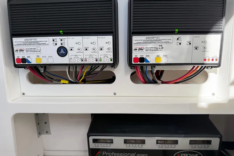  Yacht Photos Pics 2024 Sea Fox 288 Commander electrical panel with wiring and battery charger.