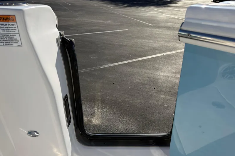  Yacht Photos Pics 2024 Sea Fox 288 Commander boat door open, showing parking lot background.