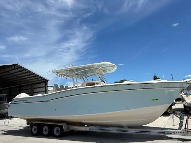 336-311 Brokerage Ron Yacht Photos Pics 2018 Grady-White Canyon 336 boat on trailer under clear blue sky.