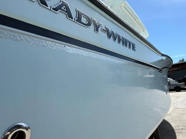 336-311 Brokerage Ron Yacht Photos Pics 2018 Grady-White Canyon 336 boat side view under clear blue sky.