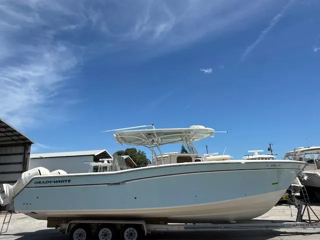 336-311 Brokerage Ron Yacht Photos Pics 2018 Grady-White Canyon 336 boat on trailer under clear blue sky.