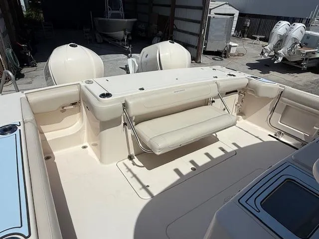 336-311 Brokerage Ron Yacht Photos Pics 2018 Grady-White Canyon 336 boat interior with seating and dual outboard engines.