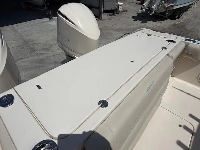 336-311 Brokerage Ron Yacht Photos Pics 2018 Grady-White Canyon 336 boat deck with engine, viewed from above.