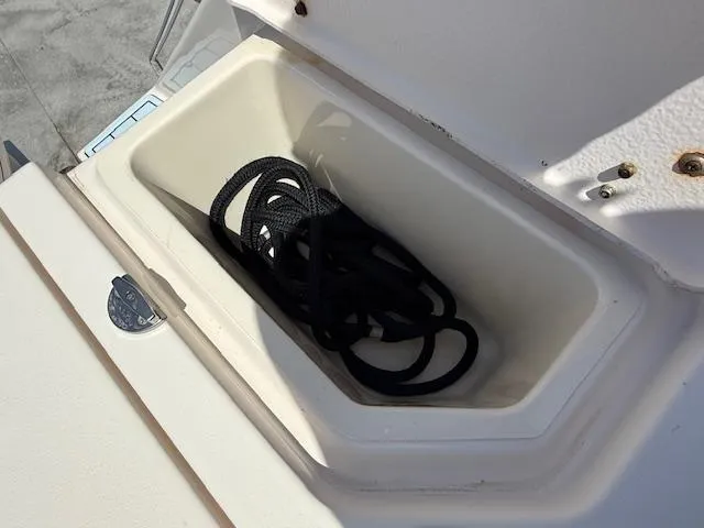 336-311 Brokerage Ron Yacht Photos Pics Storage compartment with rope on a 2018 Grady-White Canyon 336 boat.