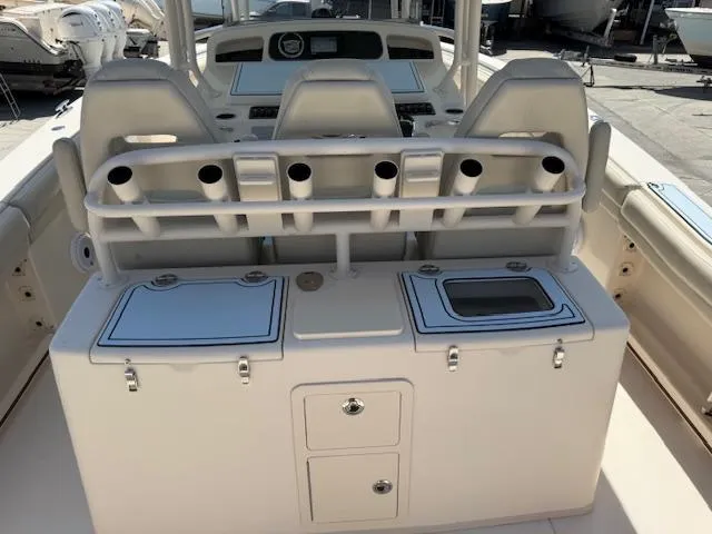 336-311 Brokerage Ron Yacht Photos Pics 2018 Grady-White Canyon 336 boat interior with rod holders and storage compartments.