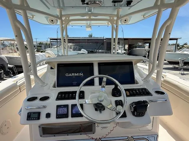 336-311 Brokerage Ron Yacht Photos Pics 2018 Grady-White Canyon 336 helm with Garmin navigation system and controls.