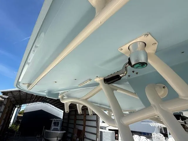 336-311 Brokerage Ron Yacht Photos Pics 2018 Grady-White Canyon 336 boat underside view in storage facility.