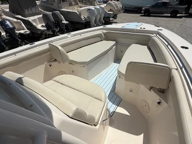 336-311 Brokerage Ron Yacht Photos Pics 2018 Grady-White Canyon 336 boat interior with cushioned seating and storage compartments.