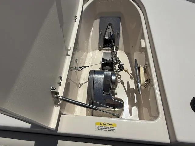 336-311 Brokerage Ron Yacht Photos Pics Anchor compartment of 2018 Grady-White Canyon 336 boat, featuring a winch and chain.