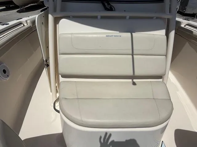 336-311 Brokerage Ron Yacht Photos Pics 2018 Grady-White Canyon 336 boat seat, white upholstery, outdoor setting.
