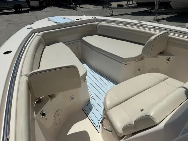336-311 Brokerage Ron Yacht Photos Pics 2018 Grady-White Canyon 336 boat interior with cushioned seating and sleek design.