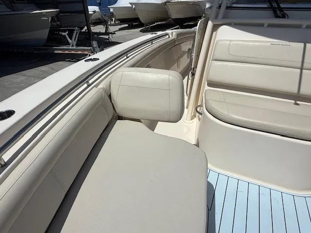 336-311 Brokerage Ron Yacht Photos Pics 2018 Grady-White Canyon 336 boat interior with beige seating and blue flooring.