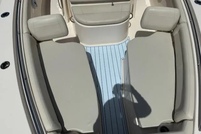 336-311 Brokerage Ron Yacht Photos Pics 2018 Grady-White Canyon 336 boat interior with cushioned seating and light blue flooring.
