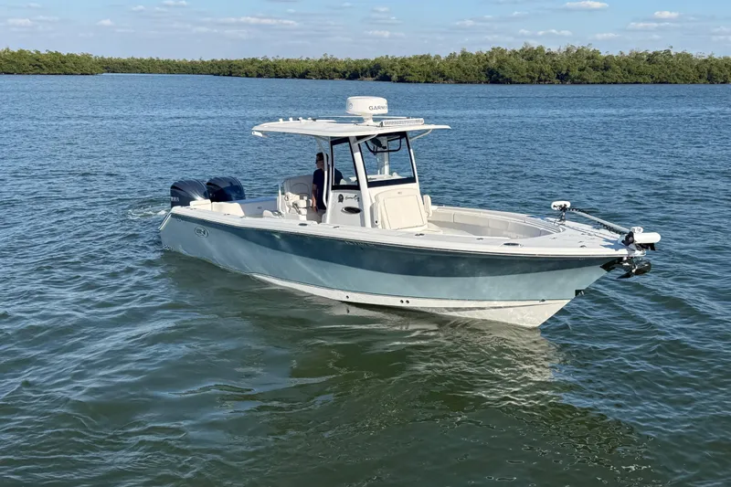  Yacht Photos Pics 2021 Sea Hunt Gamefish 30 Forward Seating boat on calm water.