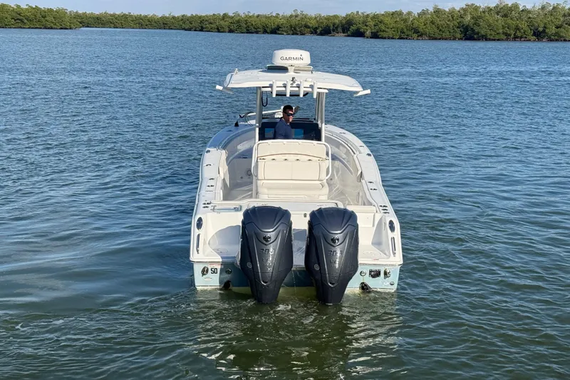  Yacht Photos Pics 2021 Sea Hunt Gamefish 30 boat with dual engines on calm water.