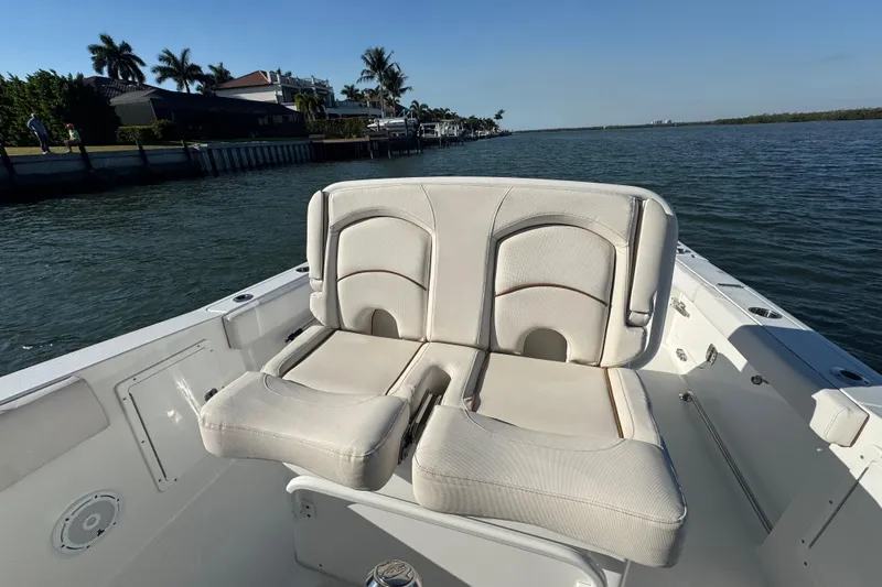  Yacht Photos Pics 2021 Sea Hunt Gamefish 30 boat with forward seating, on calm water.