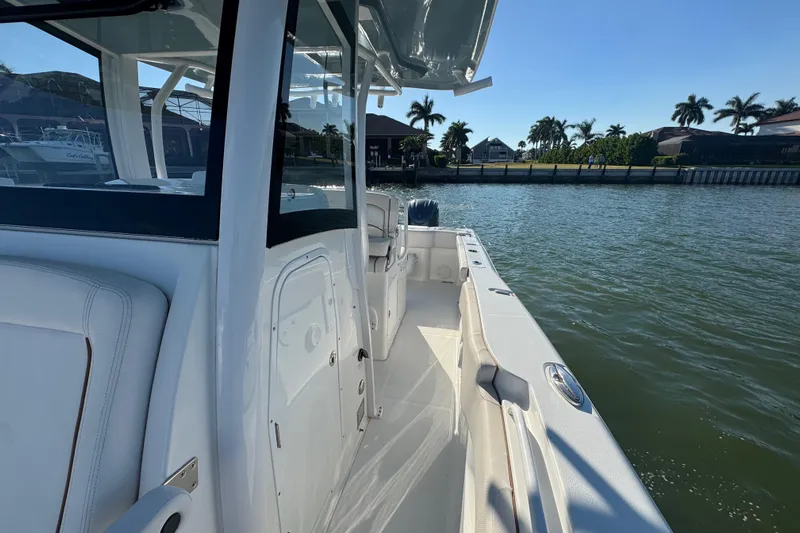  Yacht Photos Pics 2021 Sea Hunt Gamefish 30 boat with forward seating on calm water.