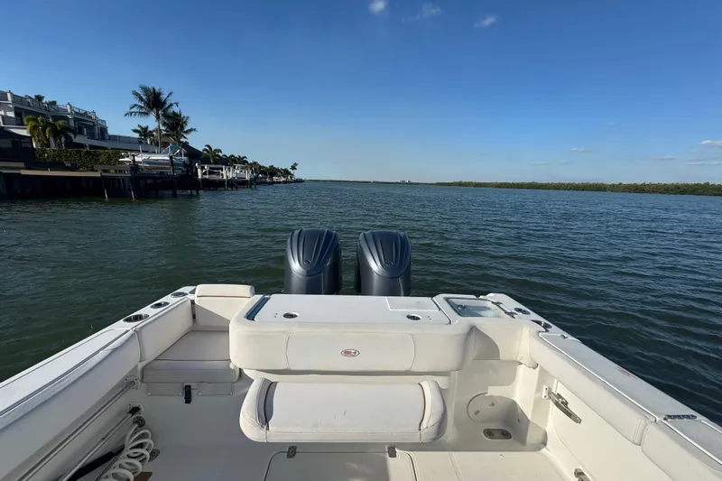  Yacht Photos Pics 2021 Sea Hunt Gamefish 30 boat on calm water with clear blue sky.