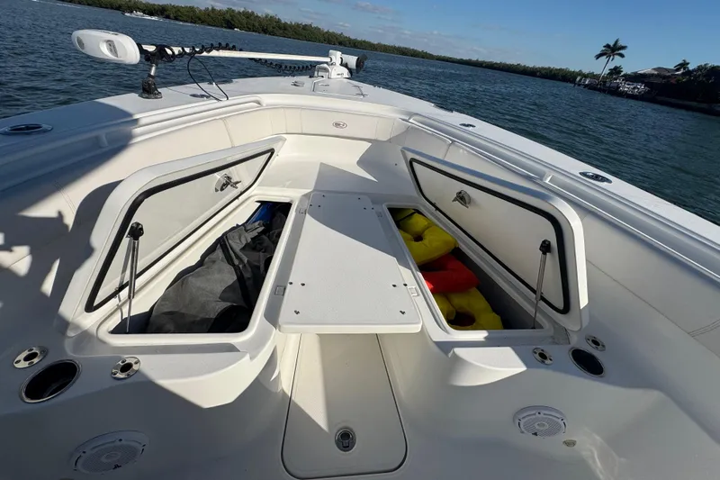  Yacht Photos Pics 2021 Sea Hunt Gamefish 30 Forward Seating with open storage compartments on a sunny day.