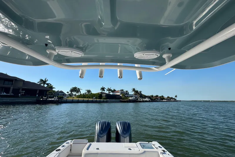  Yacht Photos Pics 2021 Sea Hunt Gamefish 30 boat on water, featuring forward seating and dual engines.