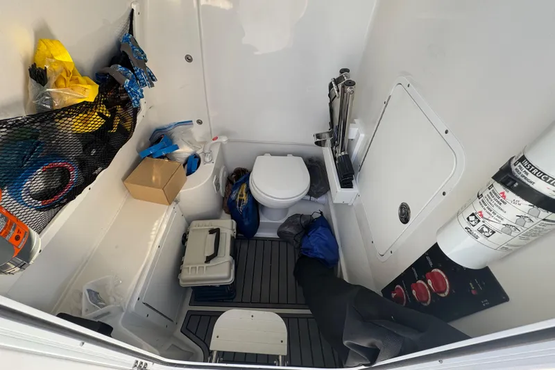  Yacht Photos Pics Interior of 2021 Sea Hunt Gamefish 30, featuring storage and marine toilet.