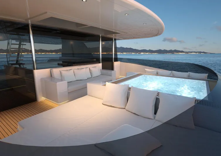 Magnolia Yacht Photos Pics Luxurious 2026 Magnolia Yachts custom model with elegant deck and jacuzzi at sunset.