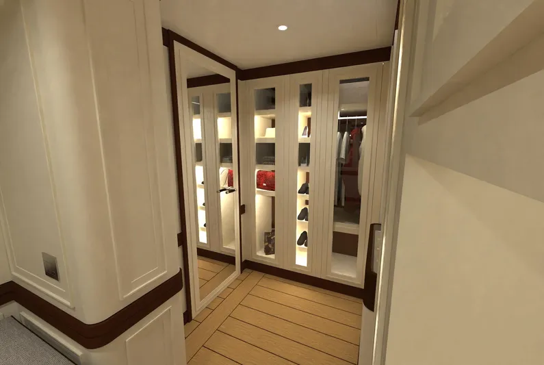 Magnolia Yacht Photos Pics Luxurious walk-in closet on 2026 Magnolia Yachts, featuring elegant shelving and mirrored doors.