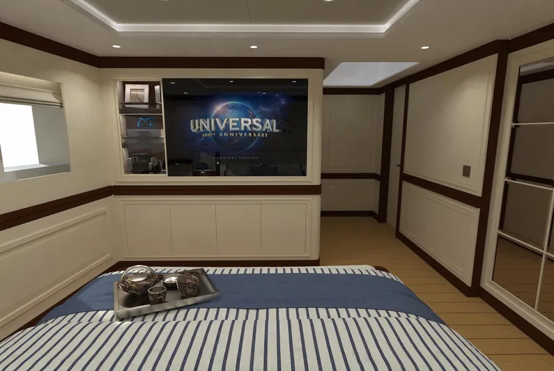 Magnolia Yacht Photos Pics Luxurious 2026 Magnolia Yachts bedroom with striped bedding and entertainment system.