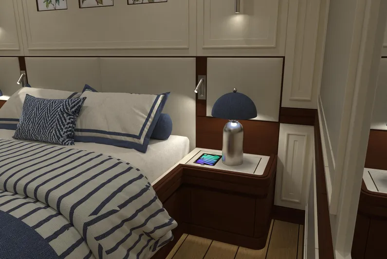 Magnolia Yacht Photos Pics Luxurious yacht bedroom interior with striped bedding, modern lamp, and wooden accents, Magnolia Yachts 2026.