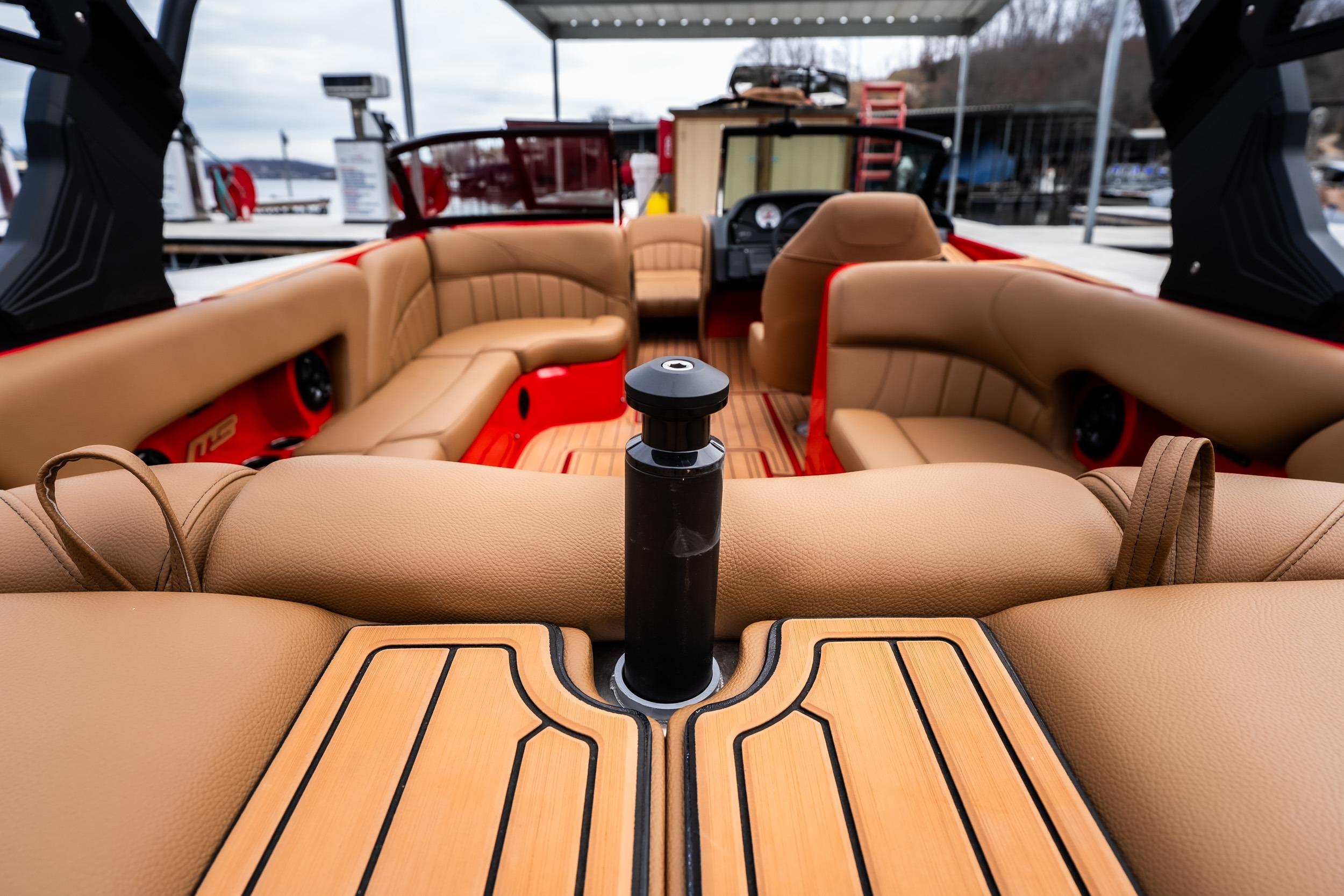 Luxurious interior of 2026 MB B52 23 Classic boat with tan leather seating.