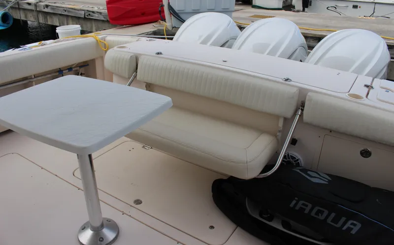  Yacht Photos Pics 2007 Grady-White 360 Express boat interior with seating and table.