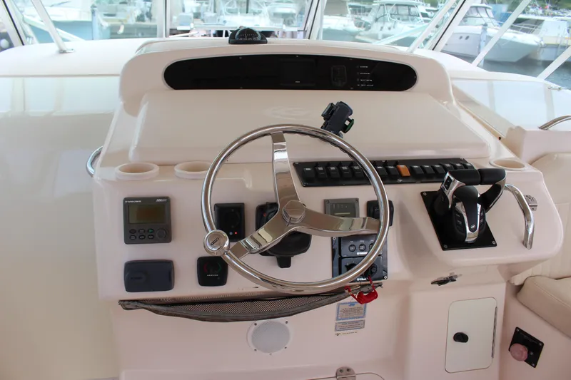  Yacht Photos Pics 2007 Grady-White 360 Express helm with steering wheel and control panel.