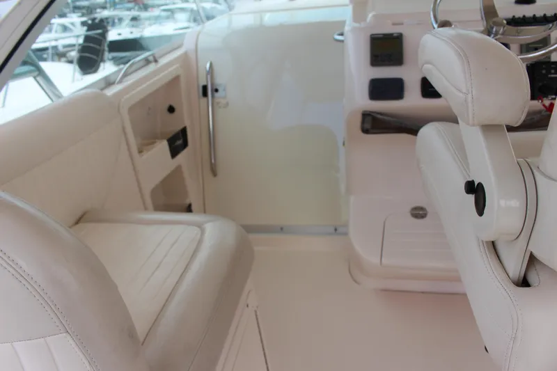  Yacht Photos Pics 2007 Grady-White 360 Express boat cockpit with white seating and control panel.