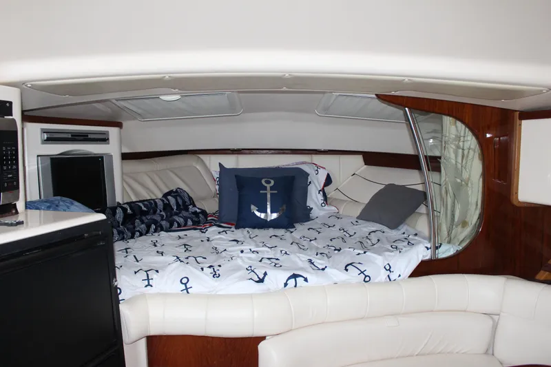  Yacht Photos Pics 2007 Grady-White 360 Express cabin with nautical-themed bedding and modern amenities.