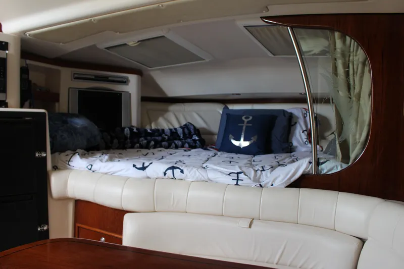  Yacht Photos Pics 2007 Grady-White 360 Express cabin interior with bed and nautical-themed decor.