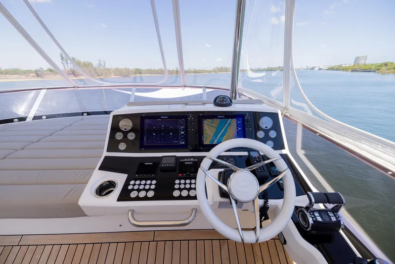 Sea Zar Yacht Photos Pics 2019 Sunseeker Manhattan 66 yacht helm with navigation screens and steering wheel.