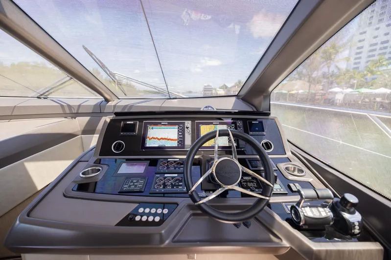 Sea Zar Yacht Photos Pics 2019 Sunseeker Manhattan 66 yacht helm with advanced navigation systems and steering wheel.