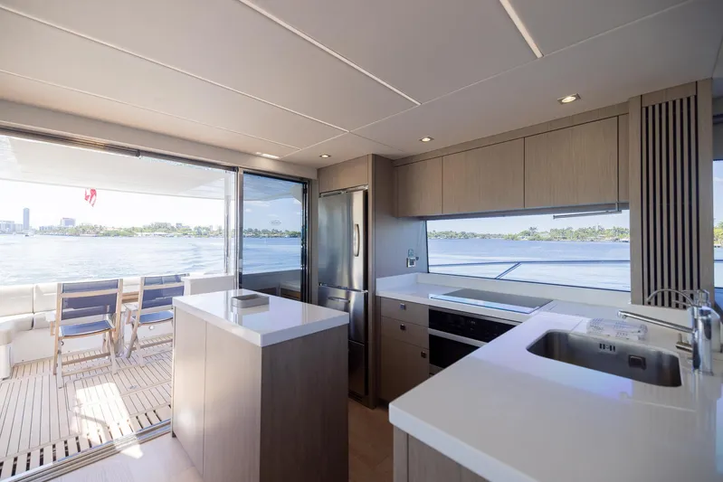 Sea Zar Yacht Photos Pics Modern kitchen and dining area on 2019 Sunseeker Manhattan 66 yacht with ocean view.
