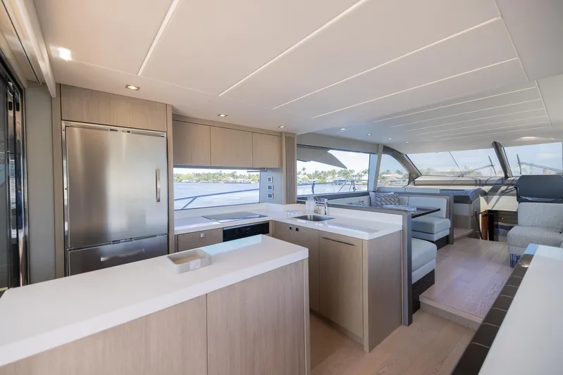 Sea Zar Yacht Photos Pics Modern interior of 2019 Sunseeker Manhattan 66 yacht with sleek kitchen and seating area.